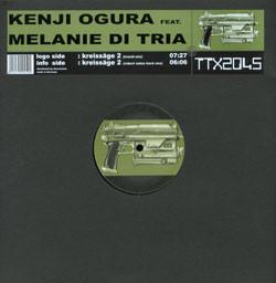 Kenji Ogura, Melanie Di Tria - Kreissäge 2